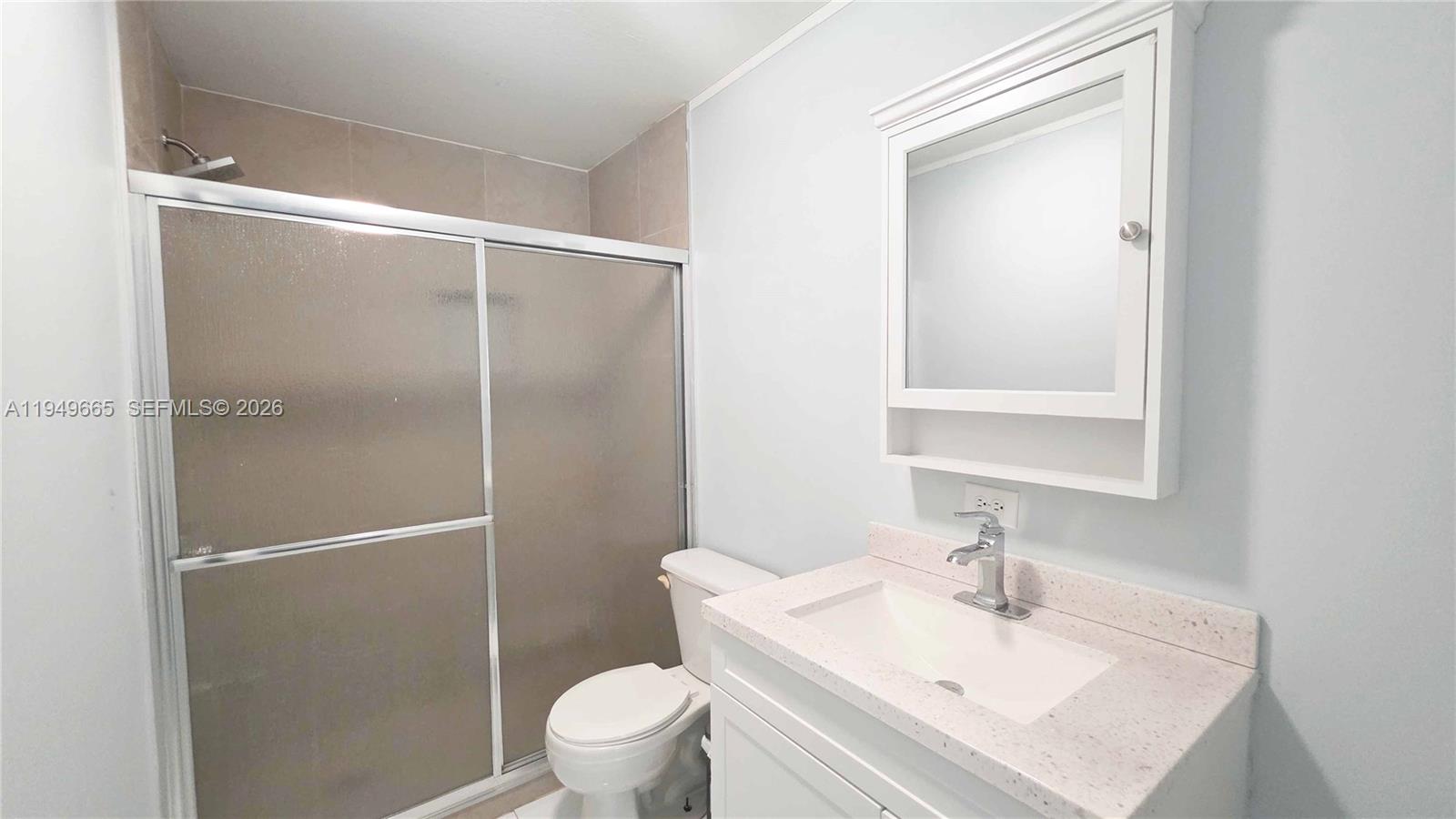 612 Hunting Clb Avenue Clewiston, FL 33440 - Photo 30 of 36 a bathroom with a sink toilet and shower