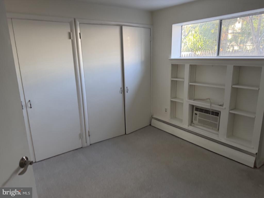 454 Old Lancaster Road, Unit 2 Haverford, PA 19041 - Photo 11 of 15 a view of an empty room with a window and closet area