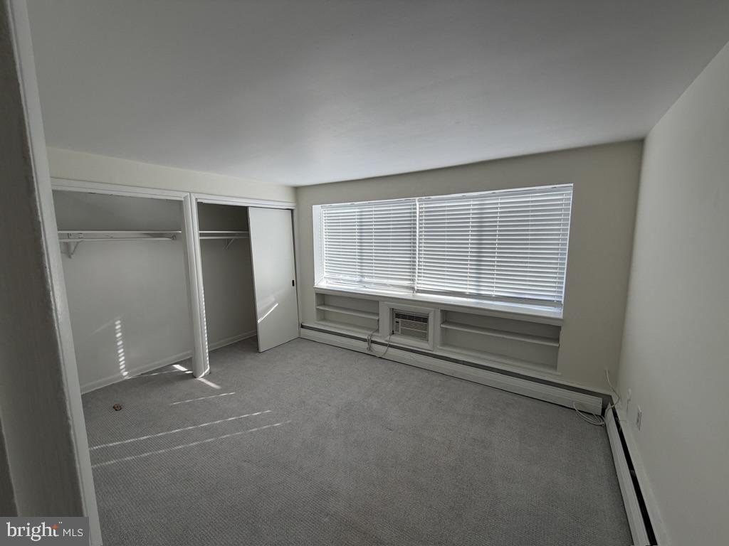 454 Old Lancaster Road, Unit 2 Haverford, PA 19041 - Photo 13 of 15 an empty room with a empty space and window