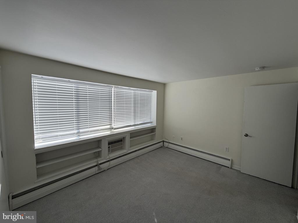 454 Old Lancaster Road, Unit 2 Haverford, PA 19041 - Photo 14 of 15 a view of an empty room with a window