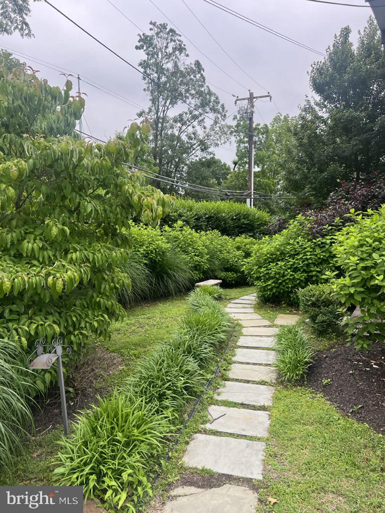 454 Old Lancaster Road, Unit 2 Haverford, PA 19041 - Photo 2 of 15 a view of a garden with pathway