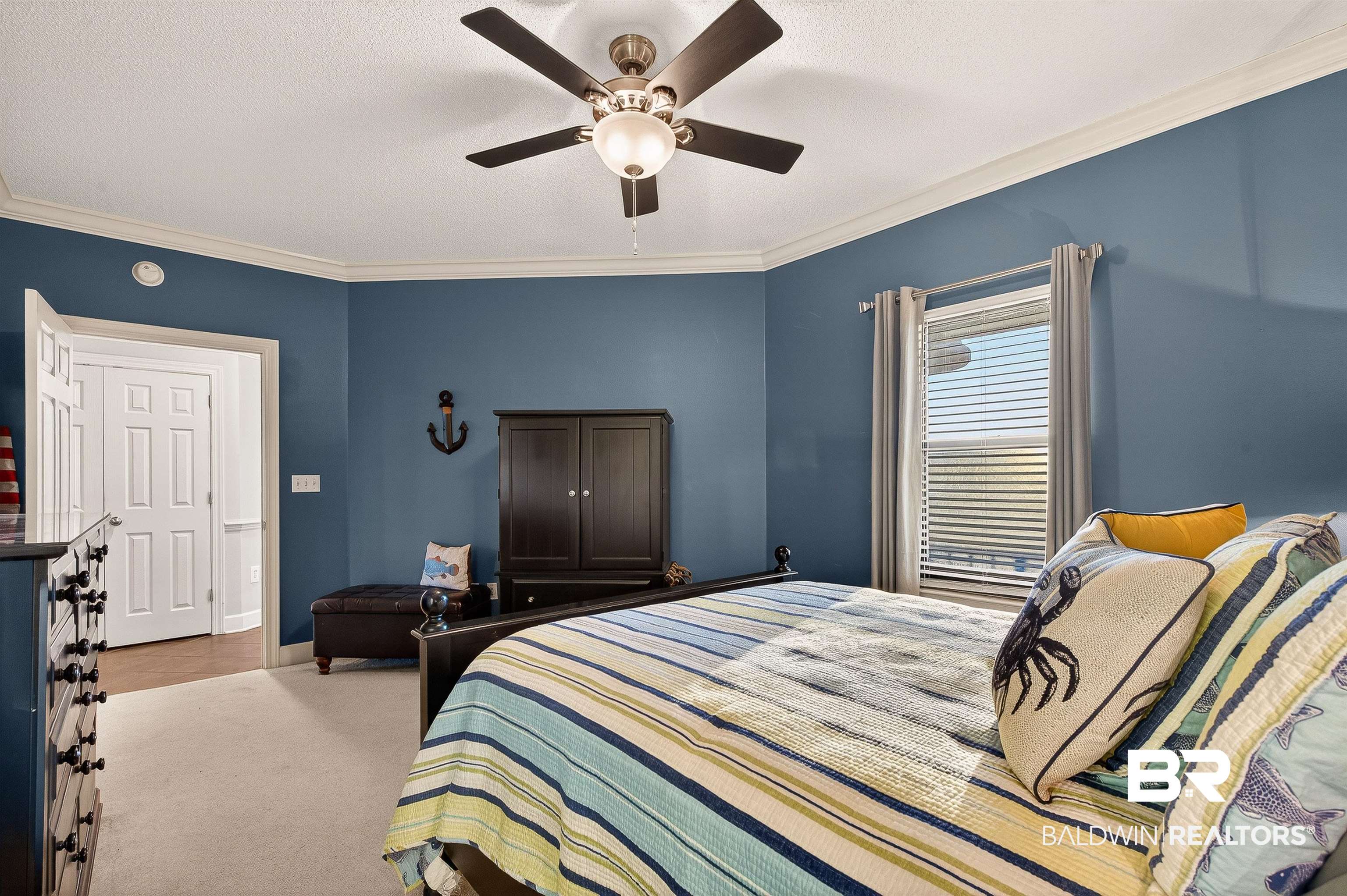 27582 Canal Road, Unit 2507 Orange Beach, AL 36561 - Photo 44 of 75 Bedroom featuring crown molding, carpet flooring, ceiling fan, and a textured ceiling