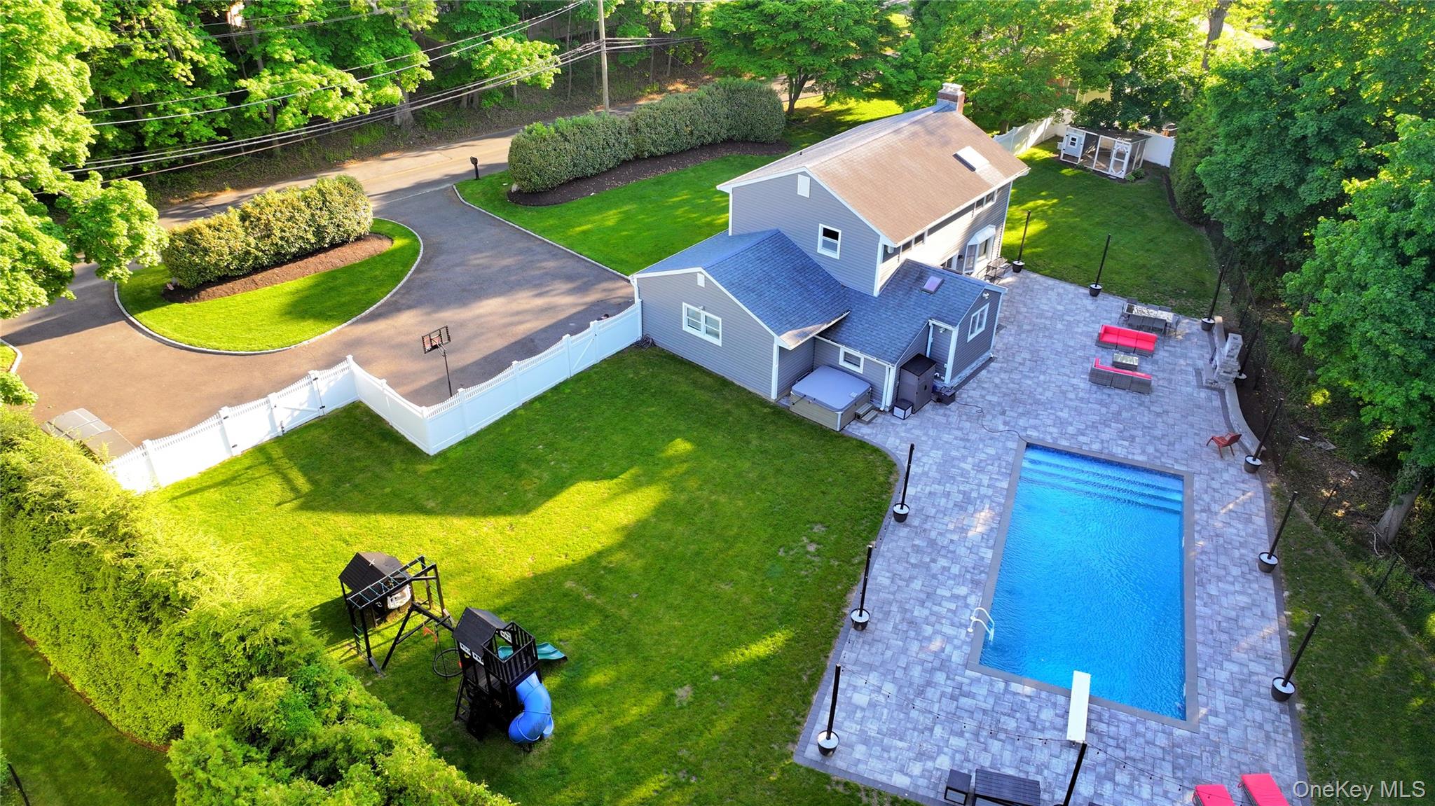 522 Moriches Road St. James, NY 11780 - Photo 49 of 49 an aerial view of a house with a garden and swimming pool