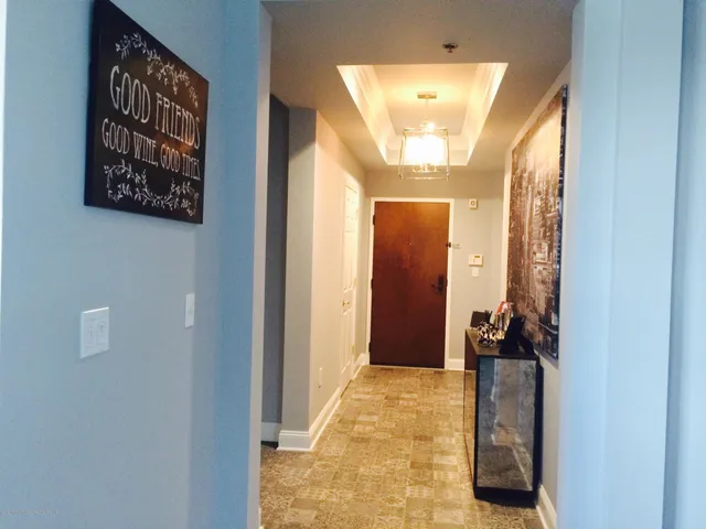 a view of a hallway with a dining area