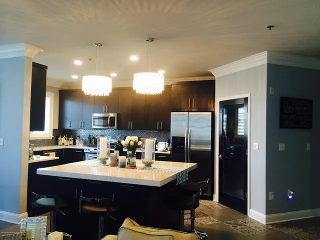 a kitchen with a sink cabinets and refrigerator