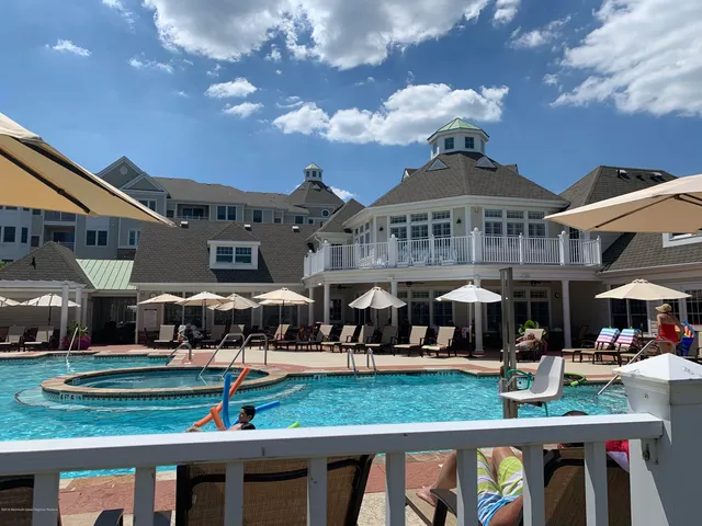 a front view of a house with a yard table and chairs