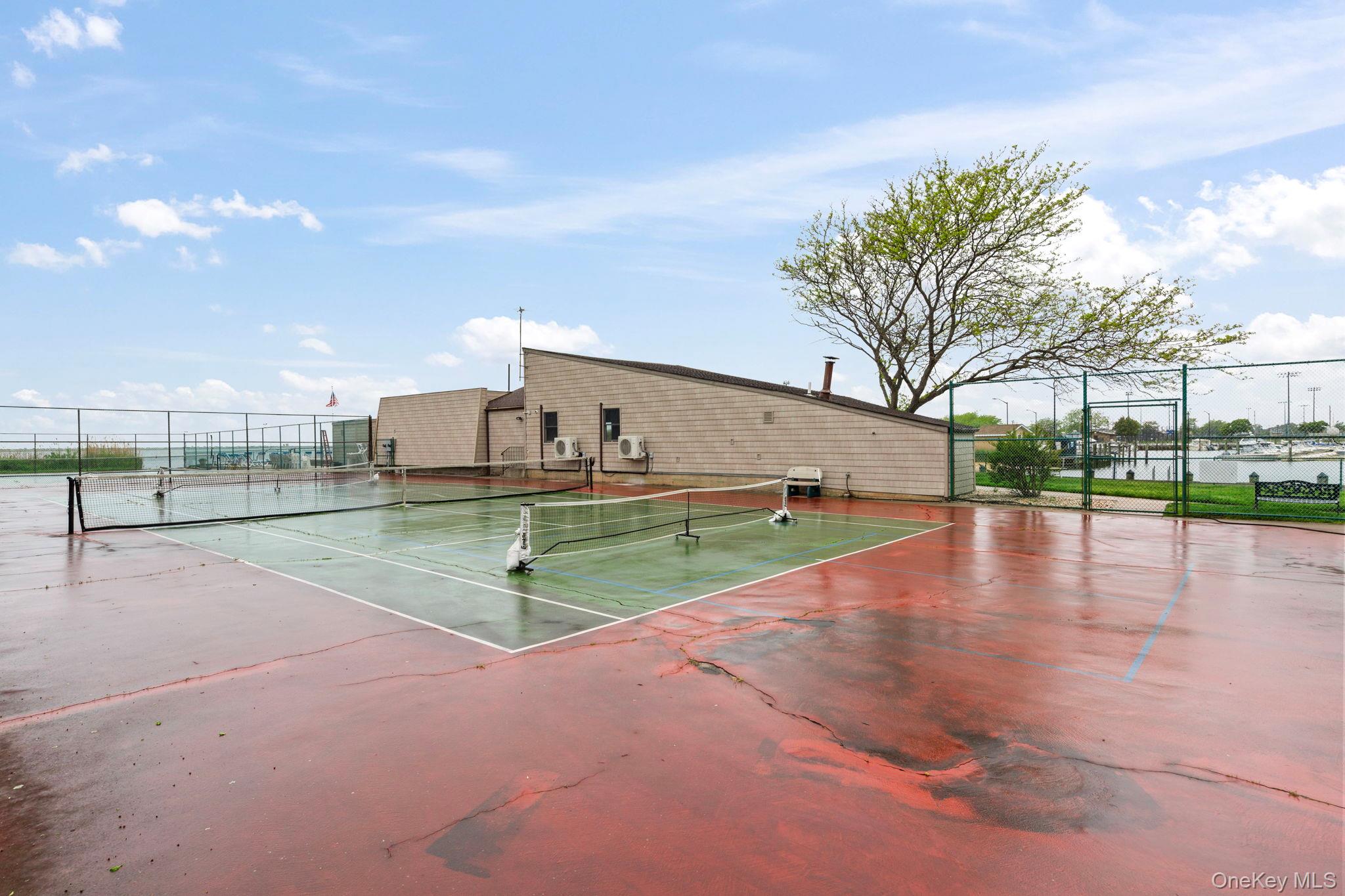 248 Mariners Way Copiague, NY 11726 - Photo 18 of 18 a view of a swimming pool with a yard