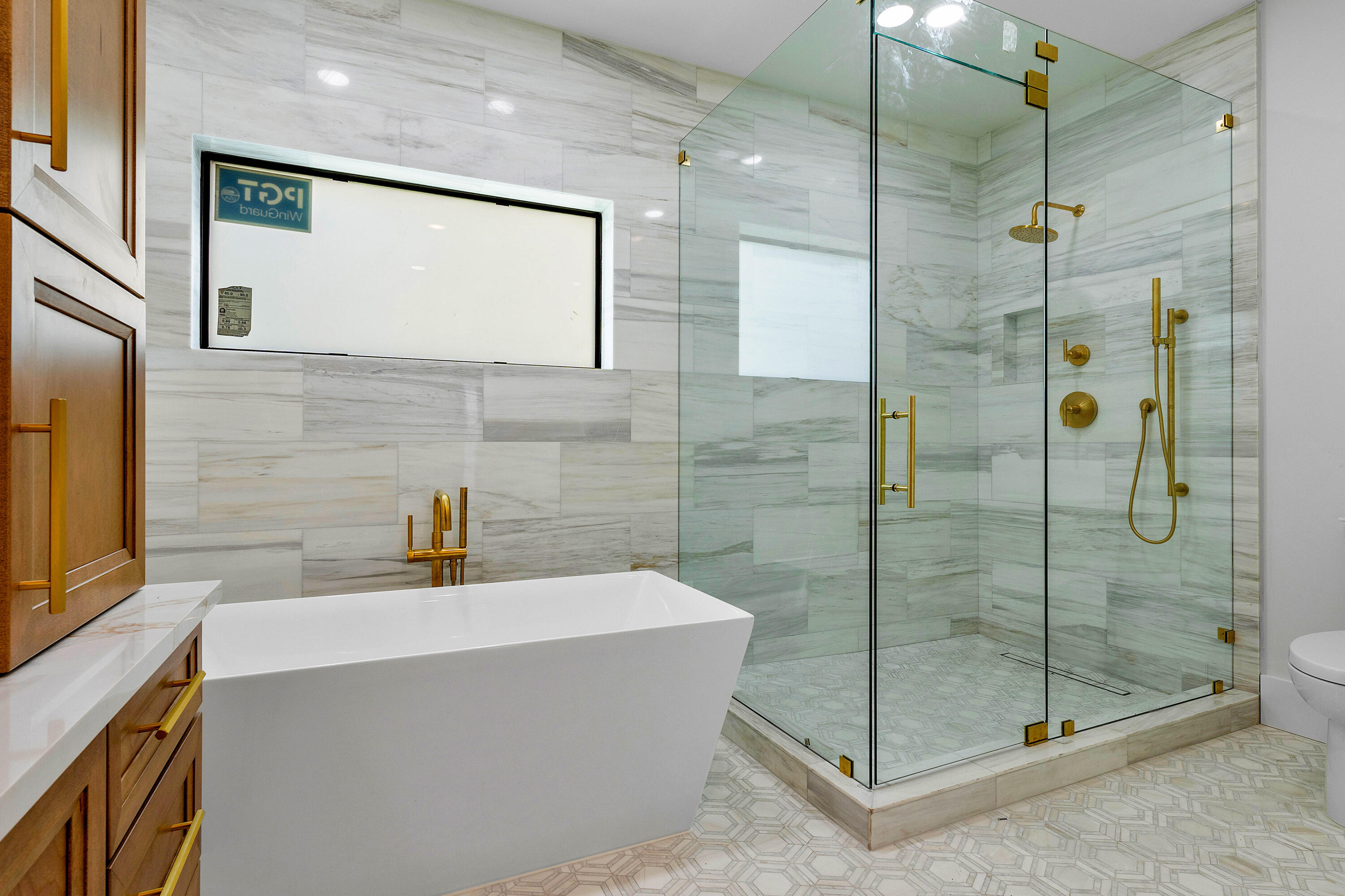 7536 Fenwick Place Boca Raton, FL 33496 - Photo 13 of 31 a bathroom with a shower and a sink