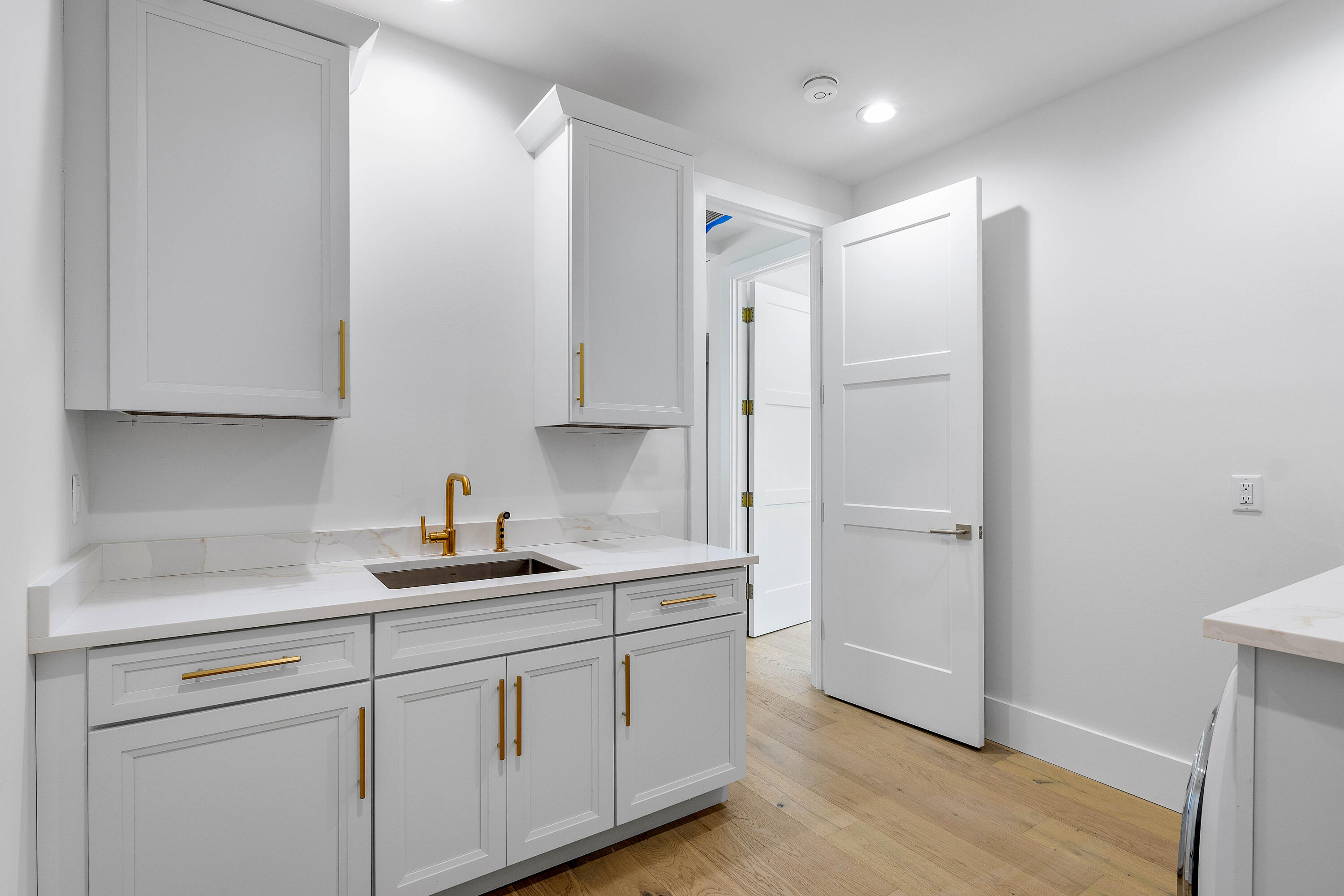7536 Fenwick Place Boca Raton, FL 33496 - Photo 21 of 31 a kitchen with a sink and cabinets