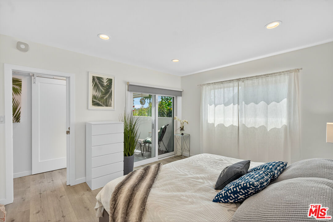 1333 14th Street, Unit 8 Santa Monica, CA 90404 - Photo 13 of 27 a bedroom with a bed and a large window