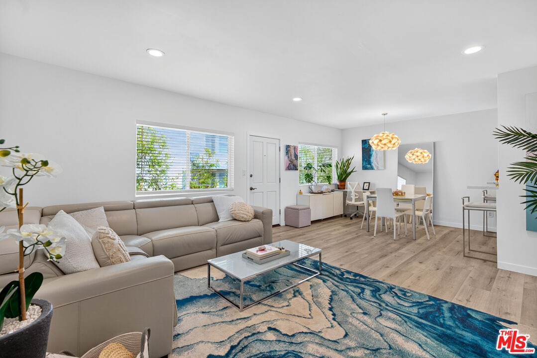 1333 14th Street, Unit 8 Santa Monica, CA 90404 - Photo 2 of 27 a living room with furniture wooden floor and a large window