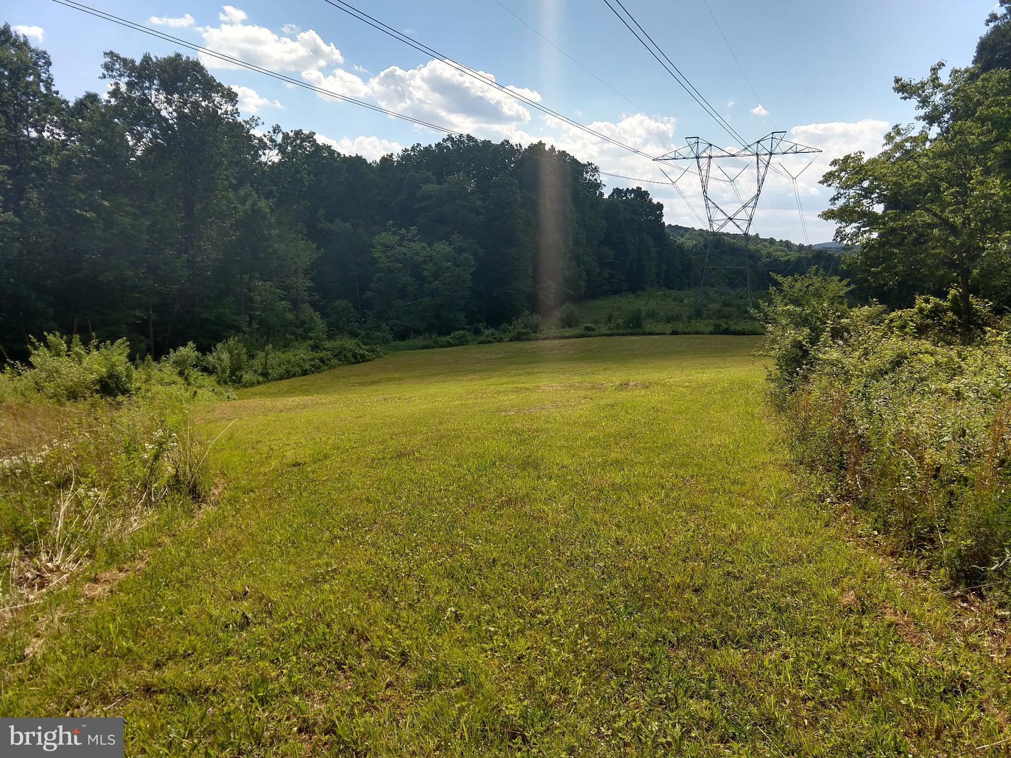8640 Hensingersville Road Alburtis, PA 18011 - Photo 27 of 32 Serene Meadow Under Blue Skies