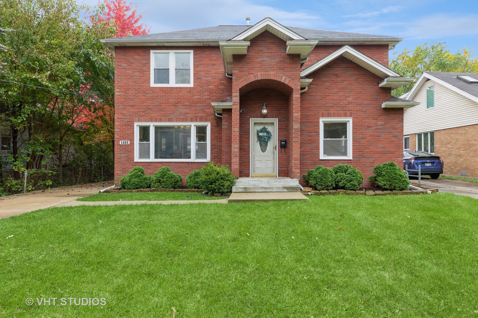a front view of a house with a yard