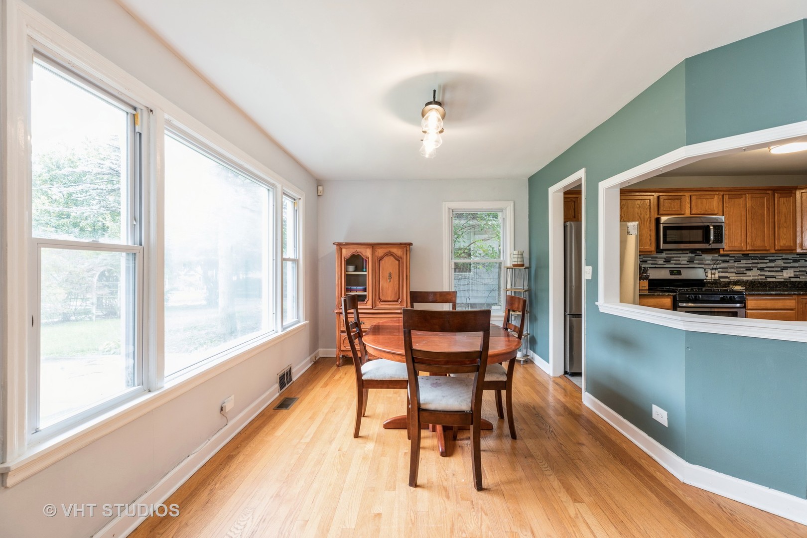1469 Burr Oak Road Homewood, IL 60430 - Photo 10 of 24 a view of a dining room with furniture window and wooden floor