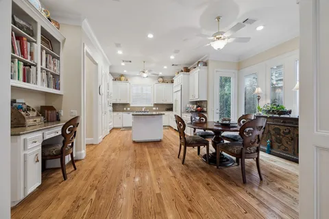 a view of a dining room with furniture and wooden floor