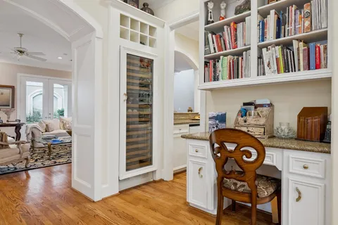 a bedroom with furniture and a book shelf