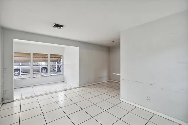 a view of an empty room and window