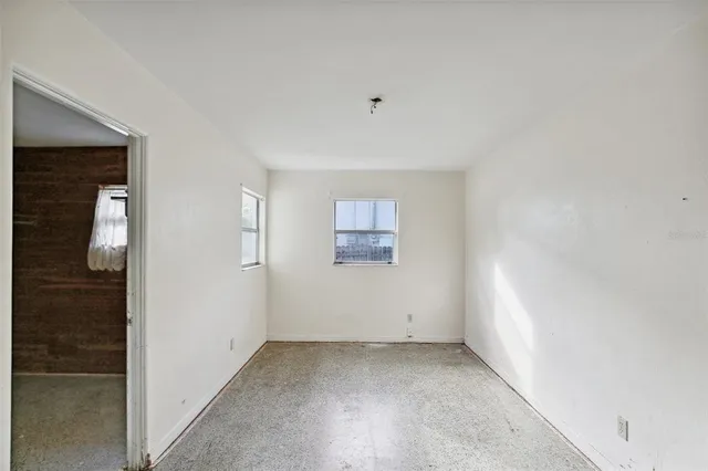 an empty room with windows