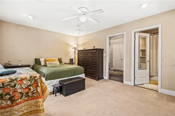 a bedroom with a bed dresser and a window