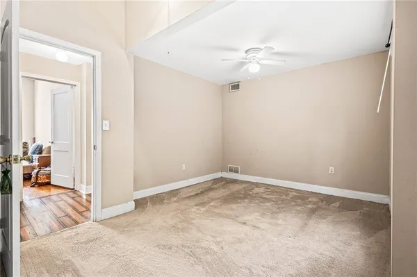a view of a livingroom with a ceiling fan