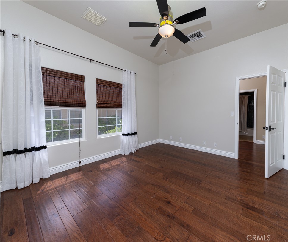 125 West Franklin Avenue Ridgecrest, CA 93555 - Photo 13 of 32 a view of empty room with wooden floor and fan