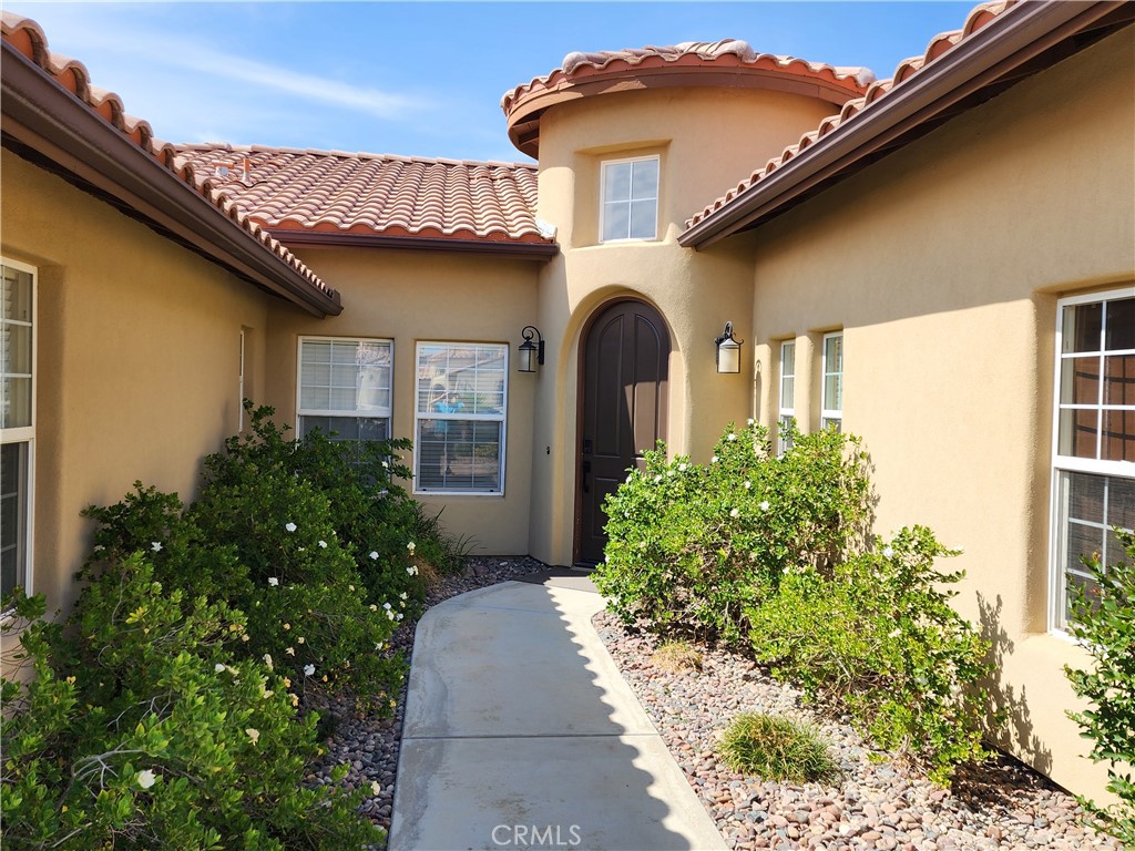 125 West Franklin Avenue Ridgecrest, CA 93555 - Photo 2 of 32 a front view of a house with garden