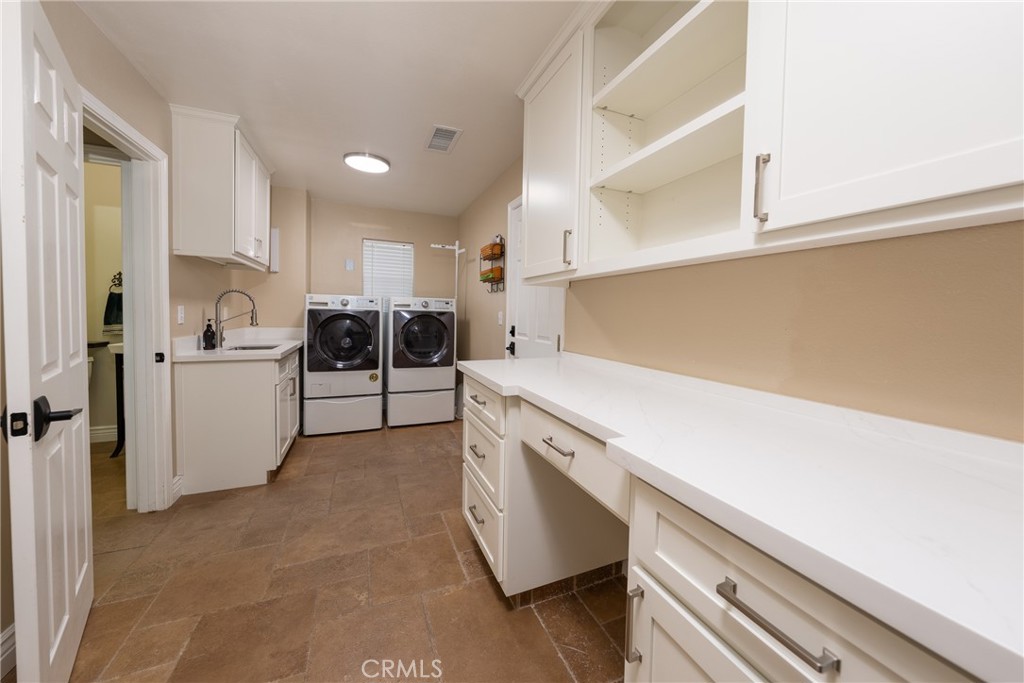 125 West Franklin Avenue Ridgecrest, CA 93555 - Photo 21 of 32 a view of a kitchen with refrigerator and cabinets