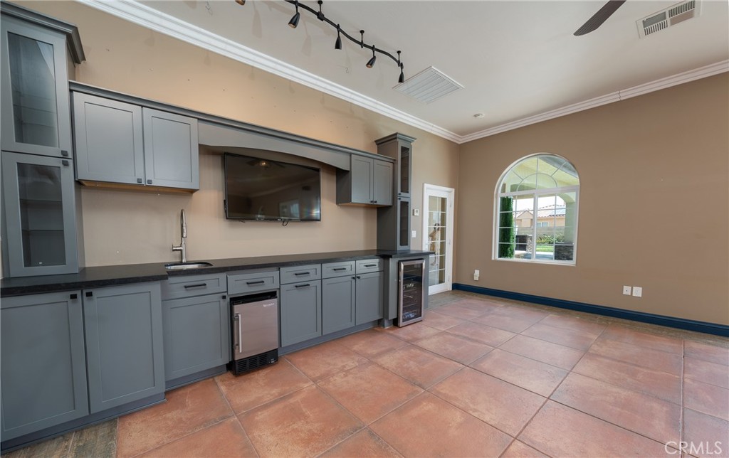 125 West Franklin Avenue Ridgecrest, CA 93555 - Photo 28 of 32 a kitchen with stainless steel appliances granite countertop a sink and cabinets