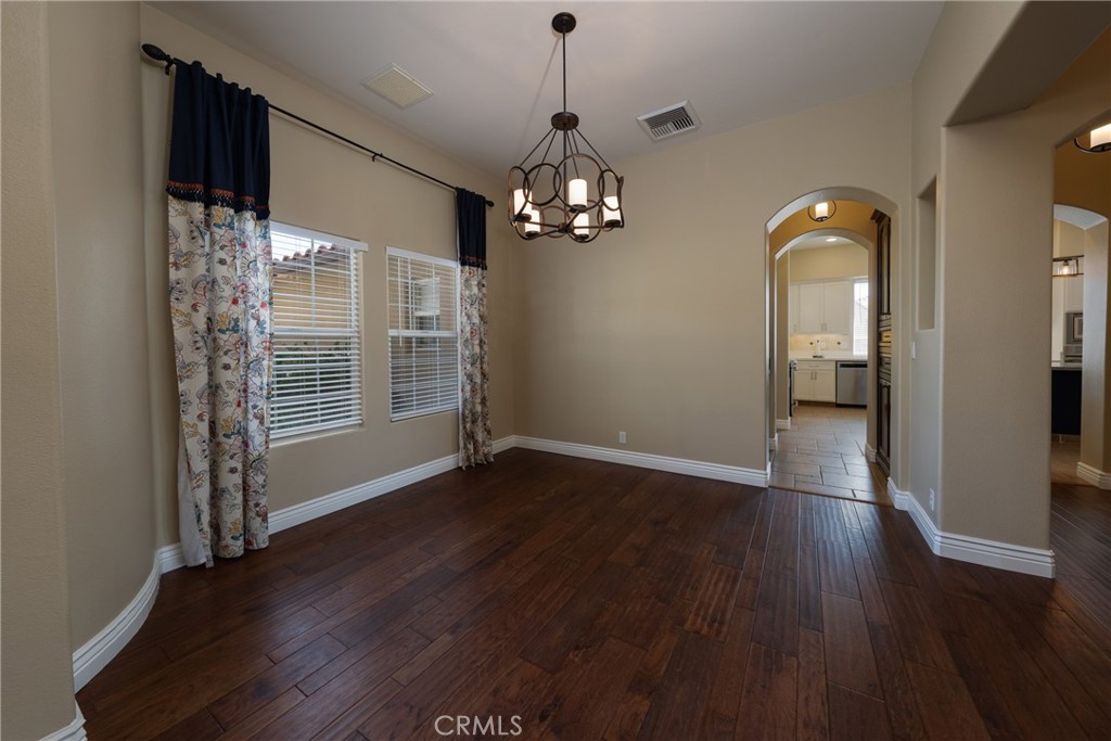 125 West Franklin Avenue Ridgecrest, CA 93555 - Photo 6 of 32 a view of a livingroom with wooden floor and a window