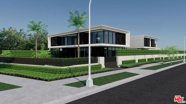 a front view of a house with a yard and green space