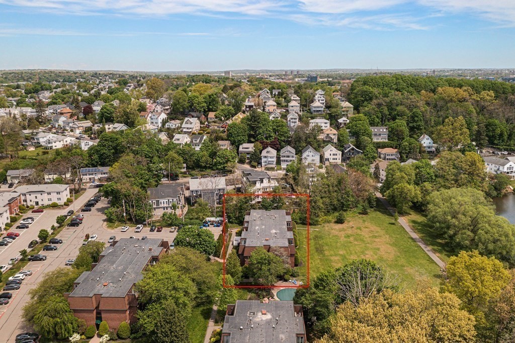 140 Kenrick Street, Unit 21 Boston, MA 02135 - Photo 31 of 36 an aerial view of residential building with green space