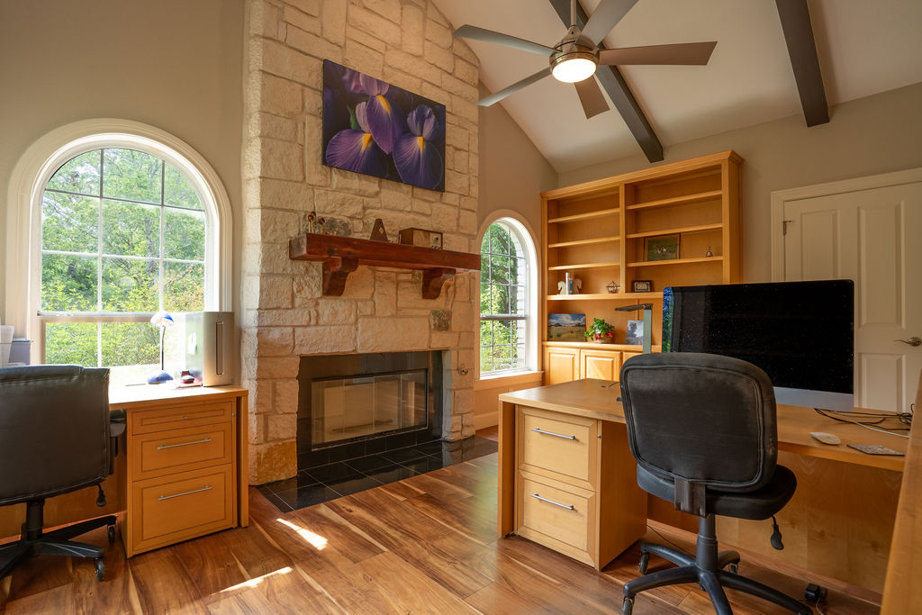 13800 Lone Rider Trail Austin, TX 78738 - Photo 13 of 27 a living room with furniture fireplace and flat screen tv