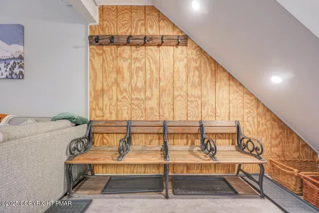 a view of staircase with a rug and a window