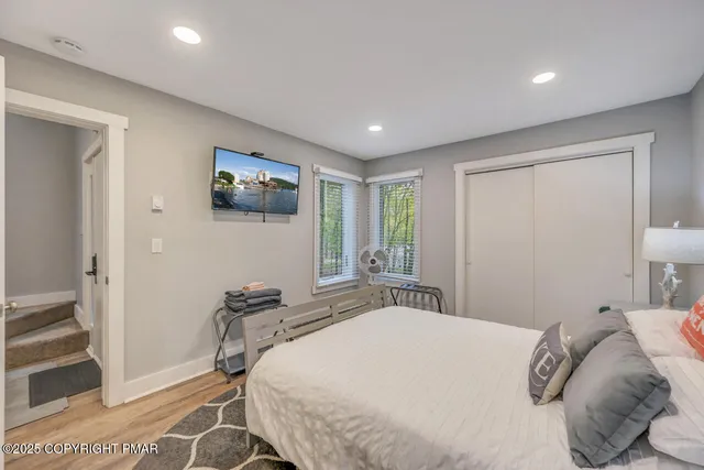 a bedroom with a bed and a view of bathroom