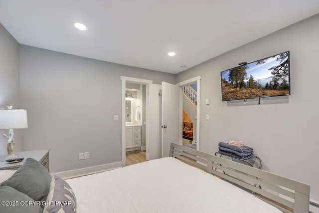 a bedroom with a bed and a lamp