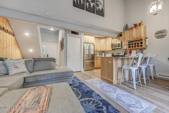 a living room with furniture and a rug
