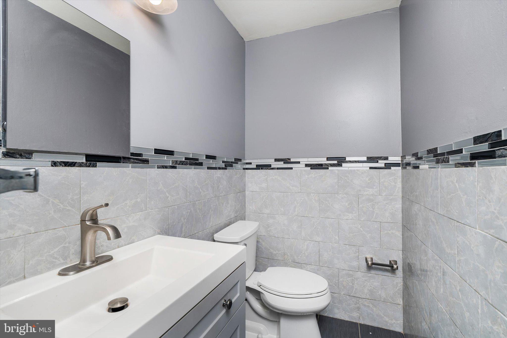 234 Probasco Road East Windsor, NJ 08520 - Photo 12 of 25 a bathroom with a sink mirror vanity and toilet