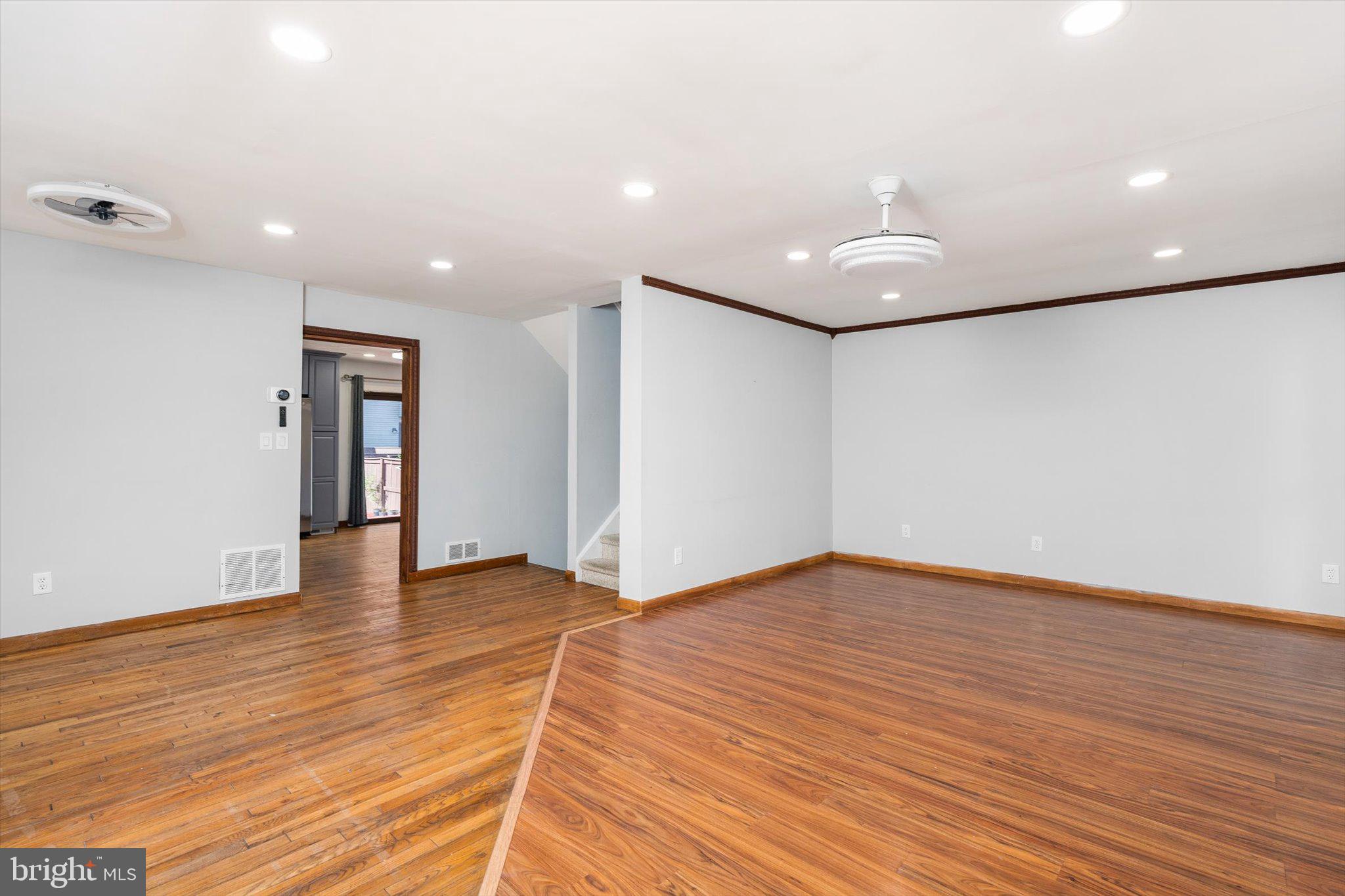 234 Probasco Road East Windsor, NJ 08520 - Photo 3 of 25 a view of an empty room with wooden floor and a window
