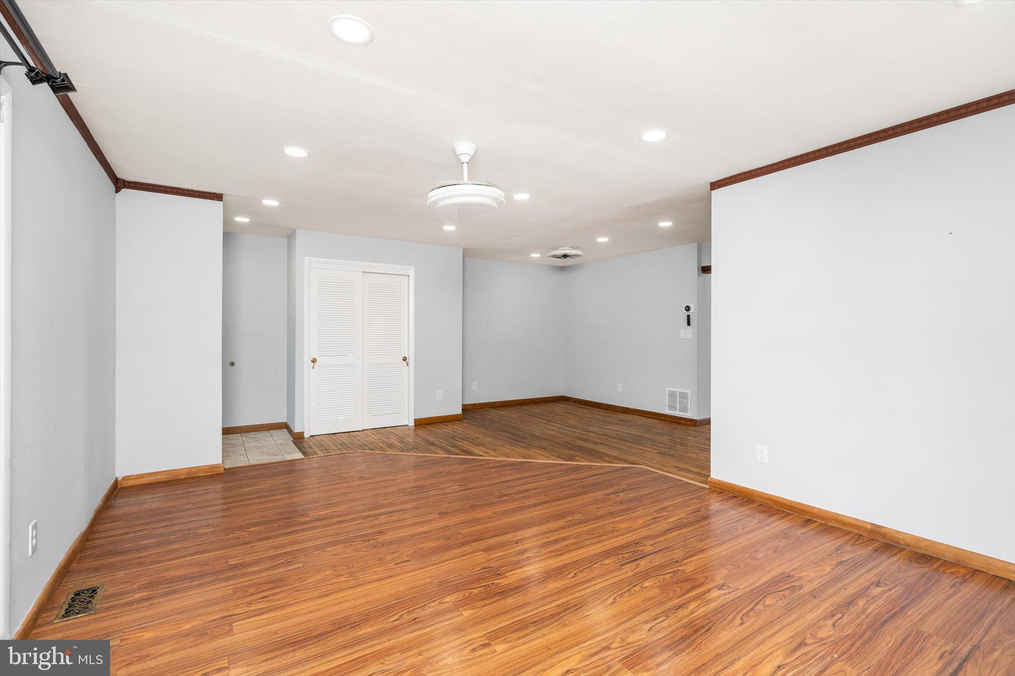 234 Probasco Road East Windsor, NJ 08520 - Photo 5 of 25 a view of an empty room with wooden floor and a window