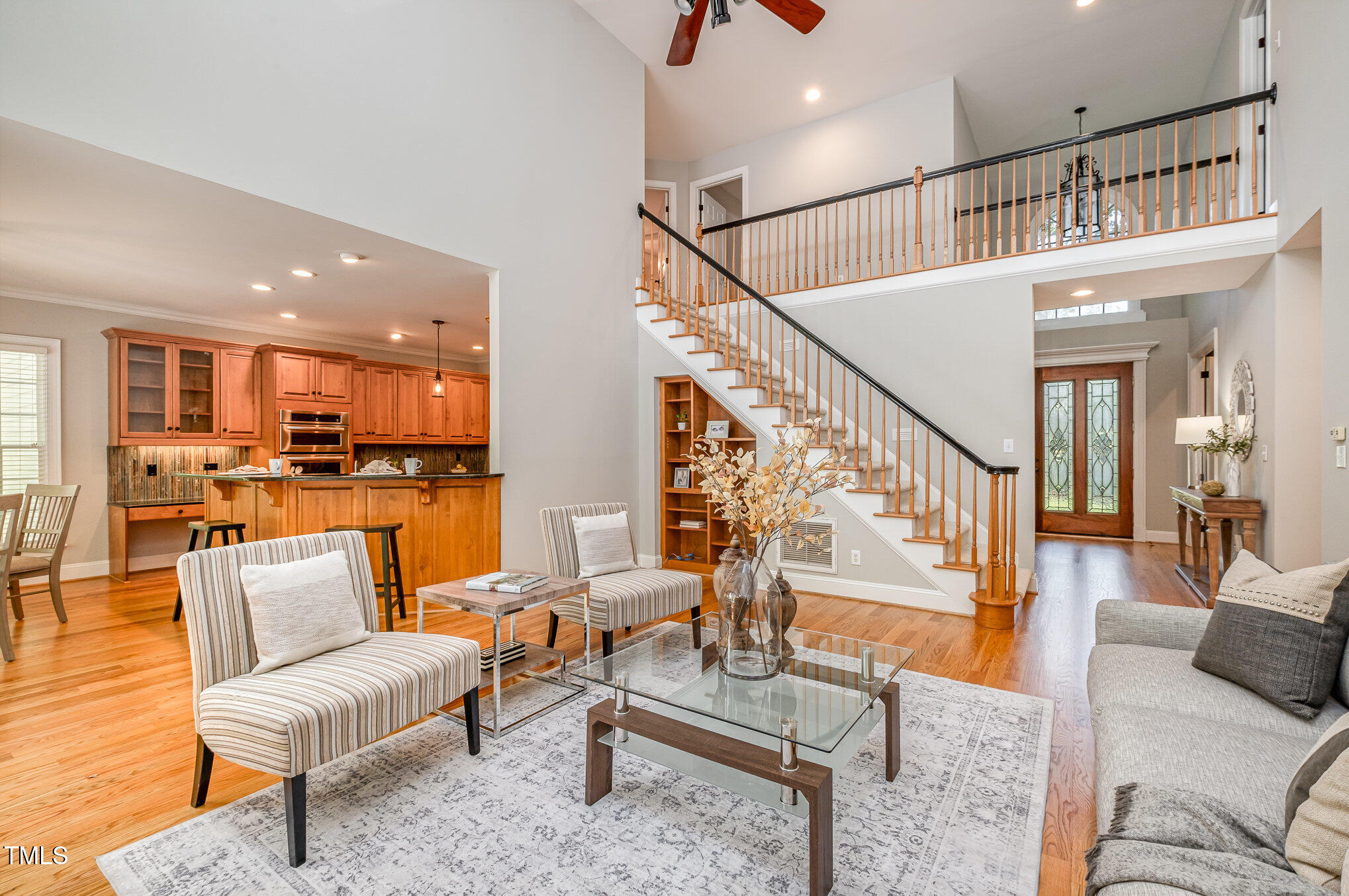 5912 Weather Rock Court Raleigh, NC 27613 - Photo 11 of 50 a living room with furniture and kitchen view with wooden floor