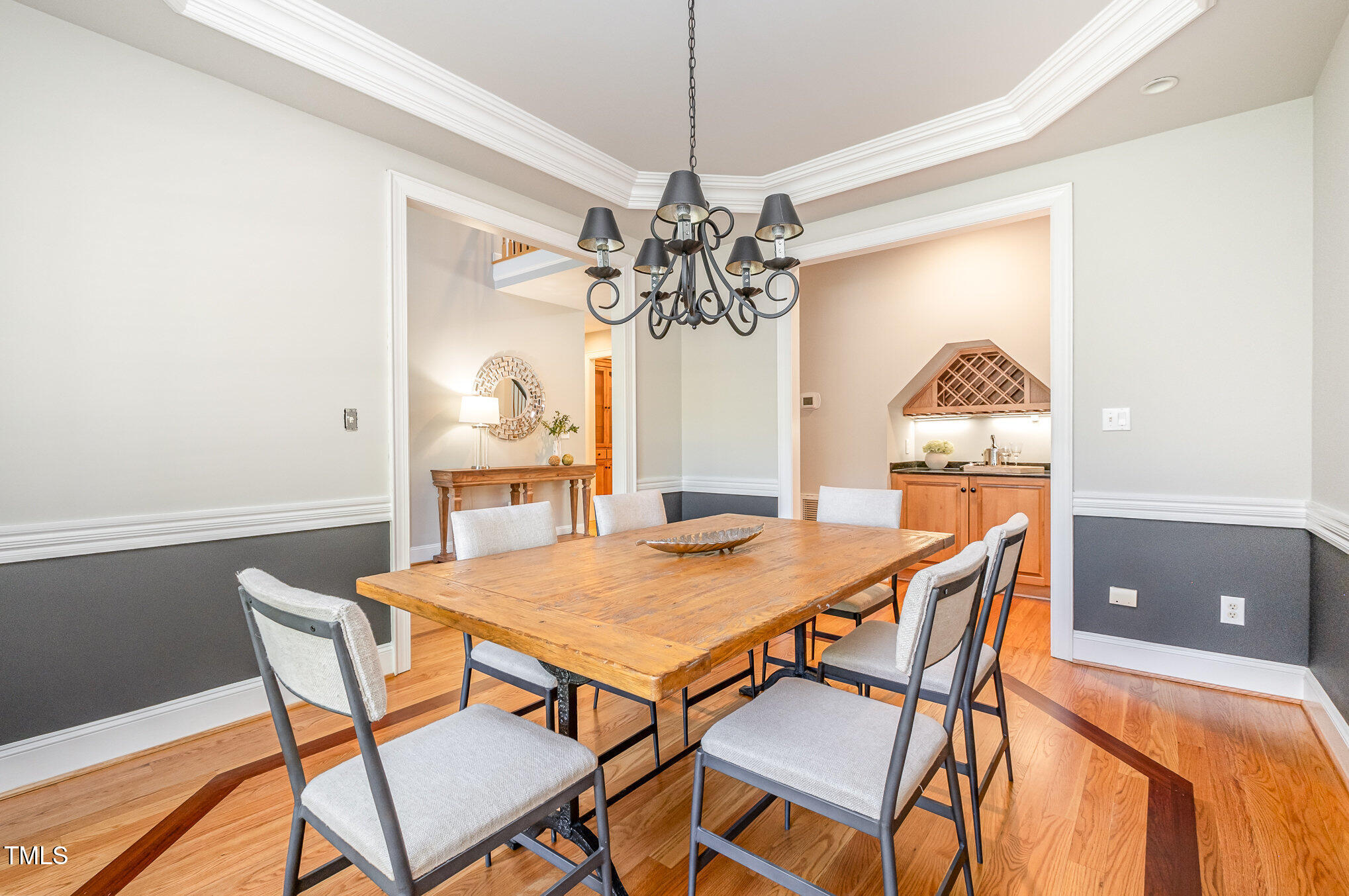 5912 Weather Rock Court Raleigh, NC 27613 - Photo 15 of 50 a view of a dining room with furniture and a chandelier