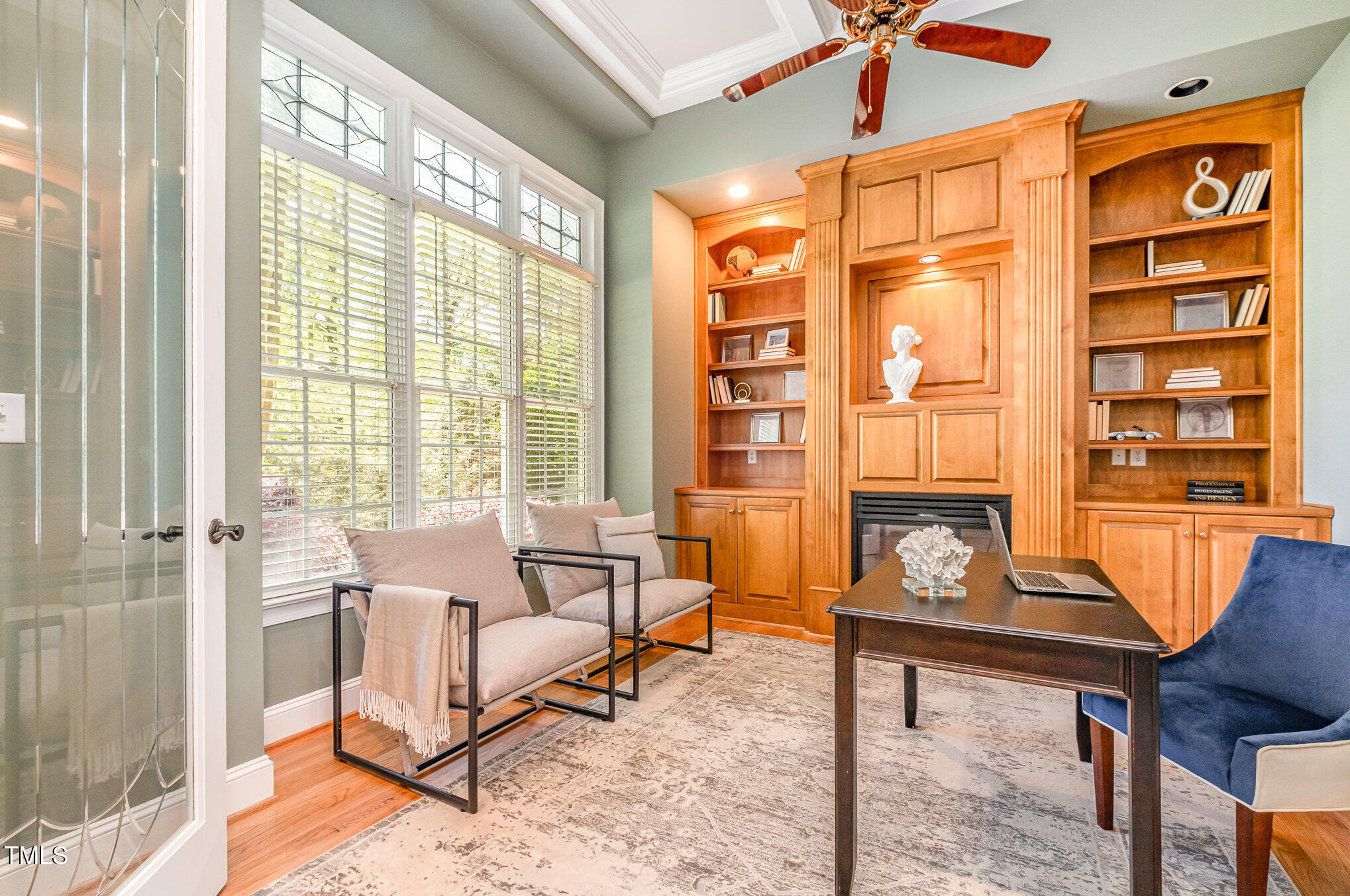 5912 Weather Rock Court Raleigh, NC 27613 - Photo 23 of 50 a living room filled with furniture and a floor to ceiling window