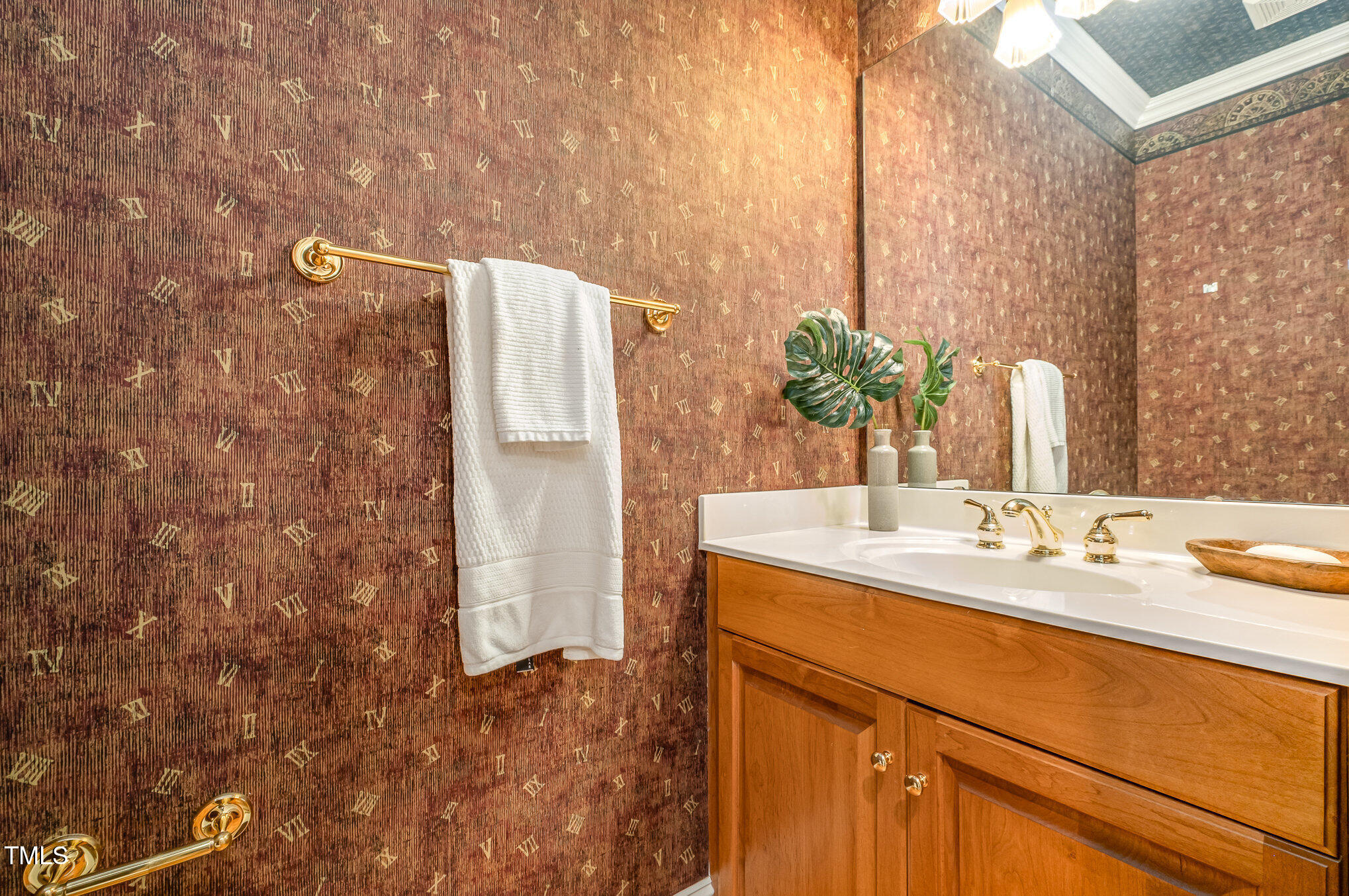 5912 Weather Rock Court Raleigh, NC 27613 - Photo 24 of 50 a bathroom with a sink and a mirror