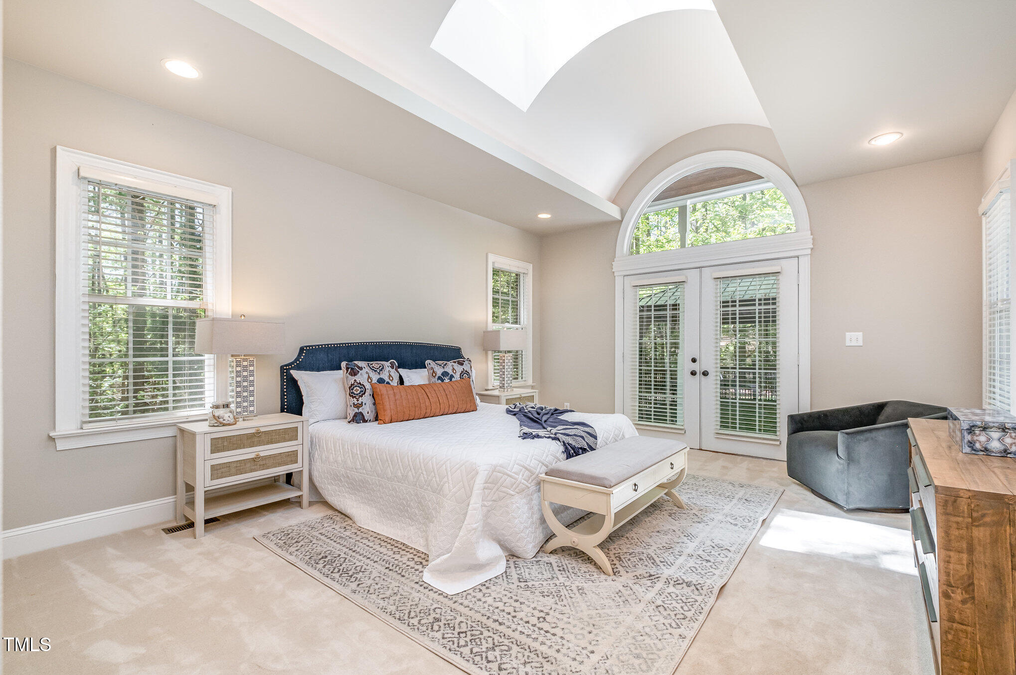 5912 Weather Rock Court Raleigh, NC 27613 - Photo 27 of 50 a bedroom with a bed and a large window