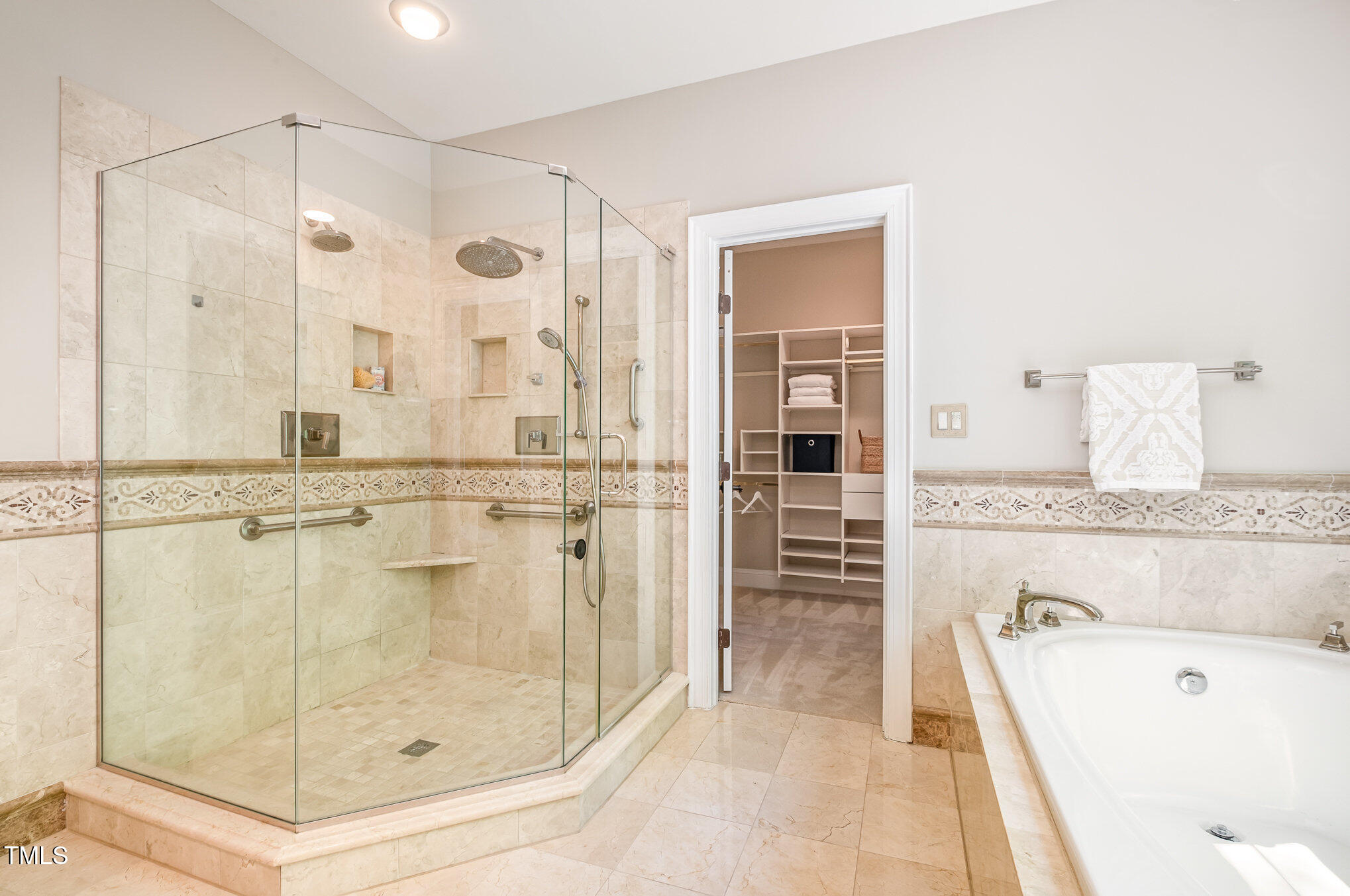 5912 Weather Rock Court Raleigh, NC 27613 - Photo 30 of 50 a bathroom with a tub shower and sink