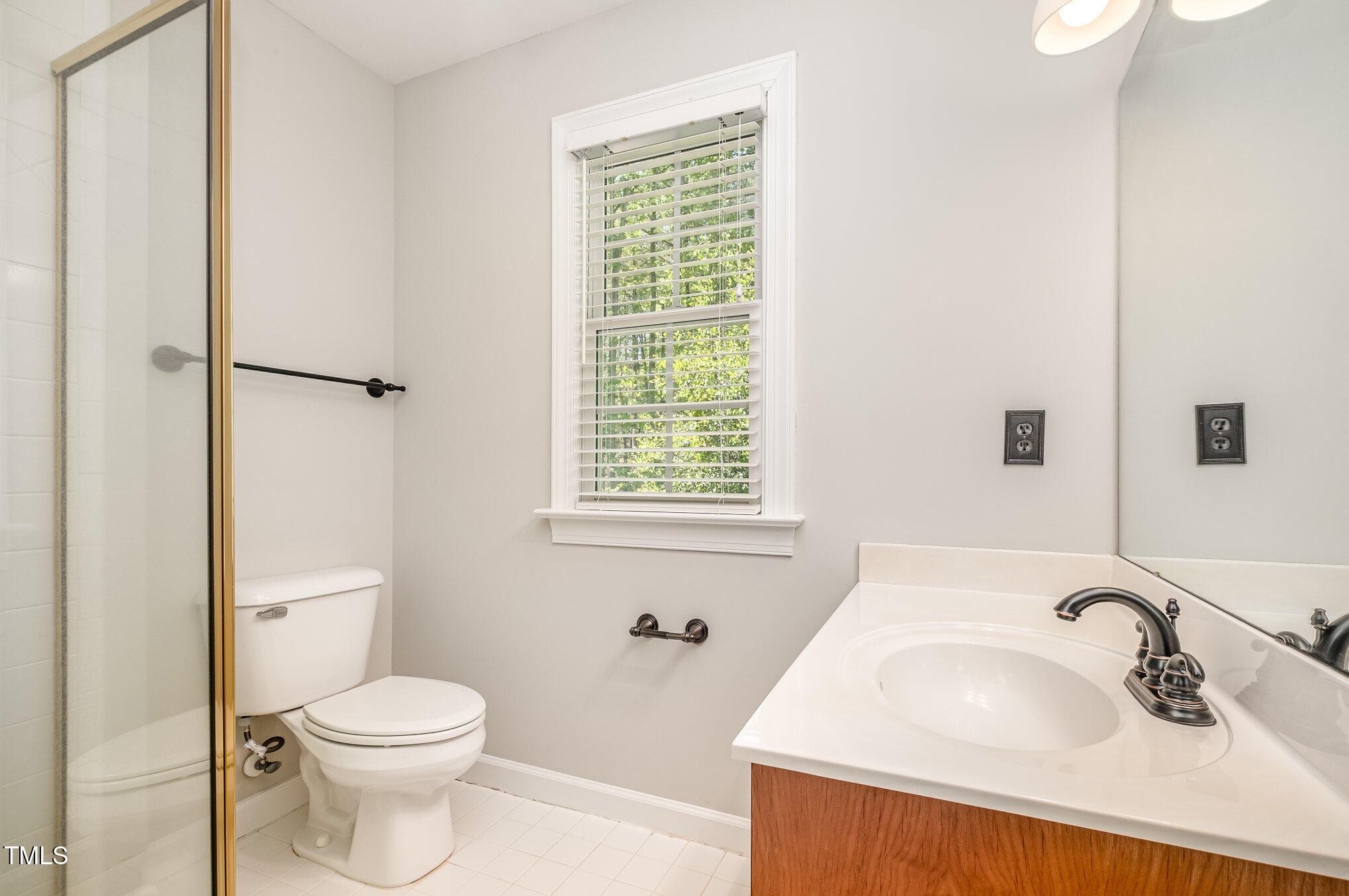 5912 Weather Rock Court Raleigh, NC 27613 - Photo 34 of 50 a bathroom with a sink toilet and shower