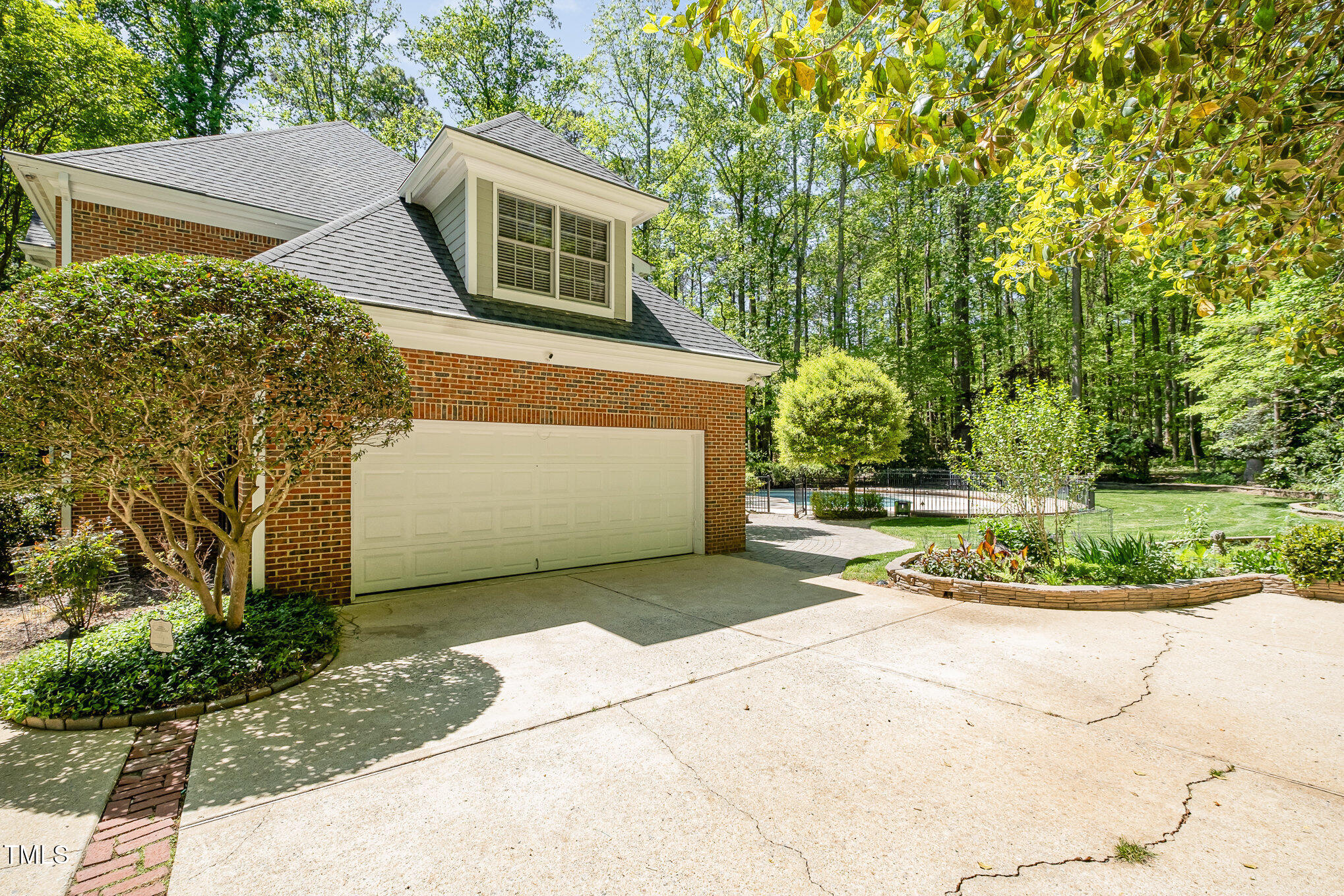 5912 Weather Rock Court Raleigh, NC 27613 - Photo 43 of 50 a front view of a house with a yard and garage