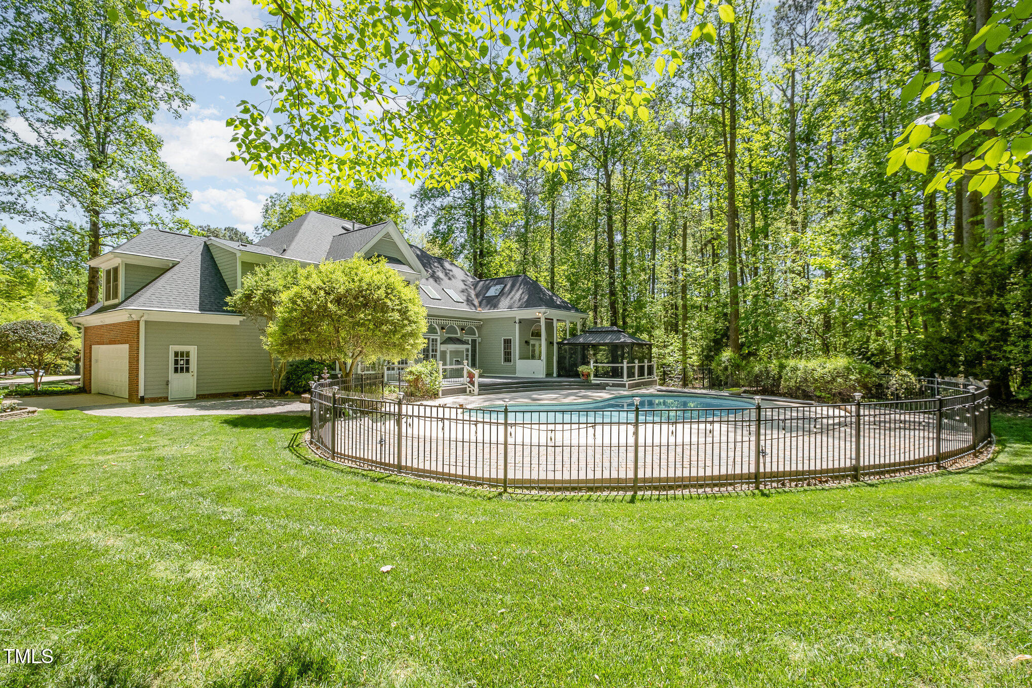 5912 Weather Rock Court Raleigh, NC 27613 - Photo 47 of 50 a view of a house with backyard and a tree