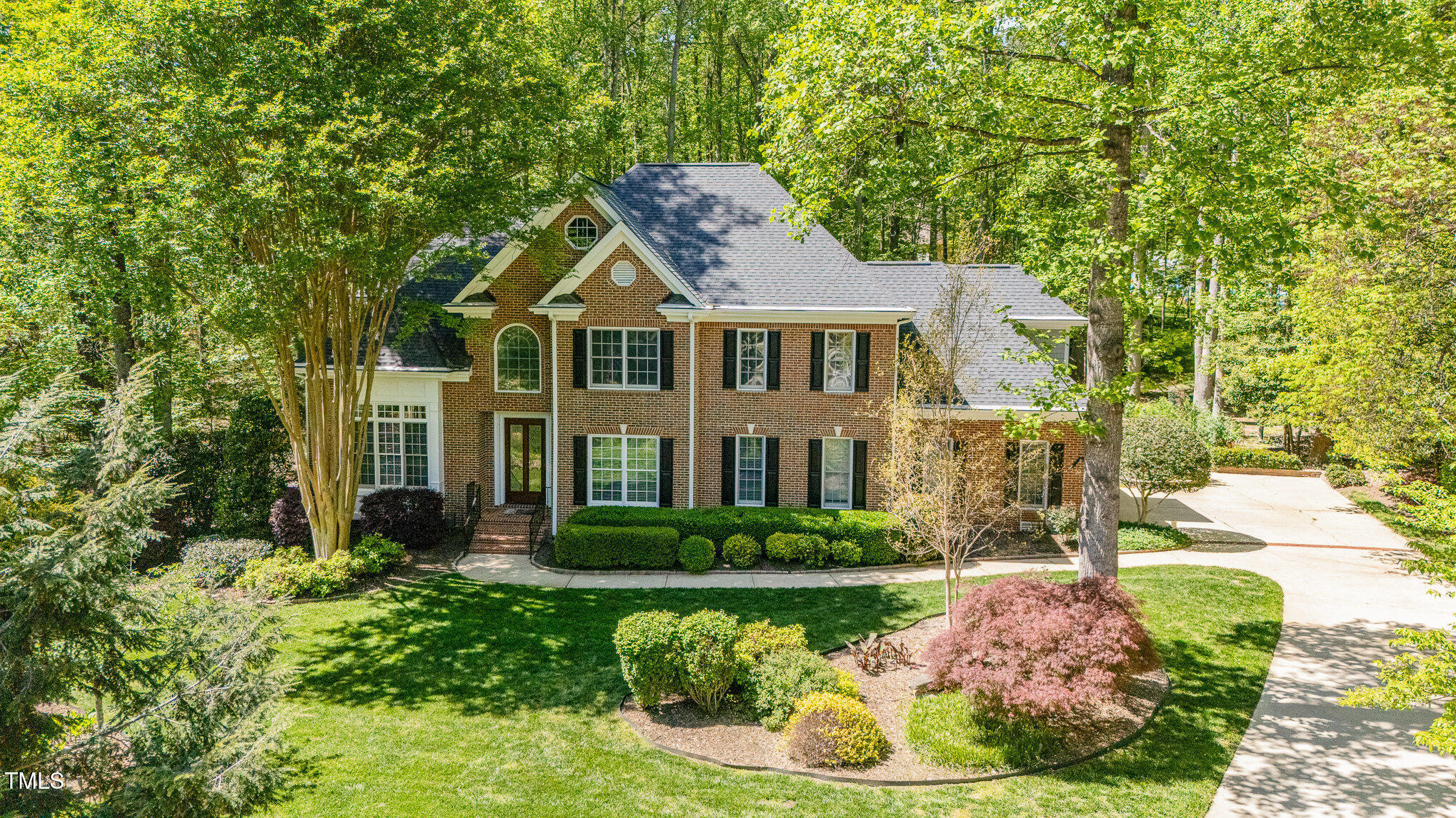 5912 Weather Rock Court Raleigh, NC 27613 - Photo 5 of 50 a front view of a house with a garden and plants