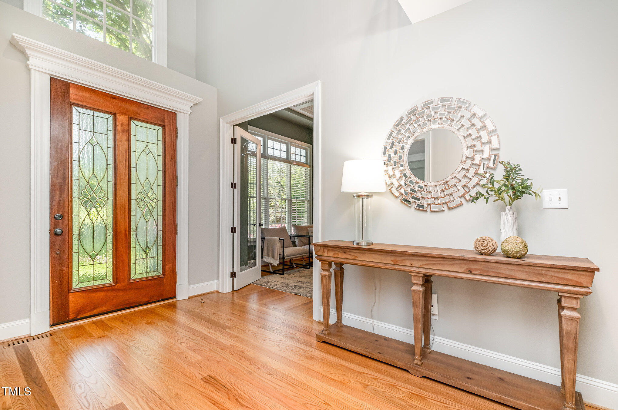 5912 Weather Rock Court Raleigh, NC 27613 - Photo 9 of 50 a view of a room with wooden floor and large windows